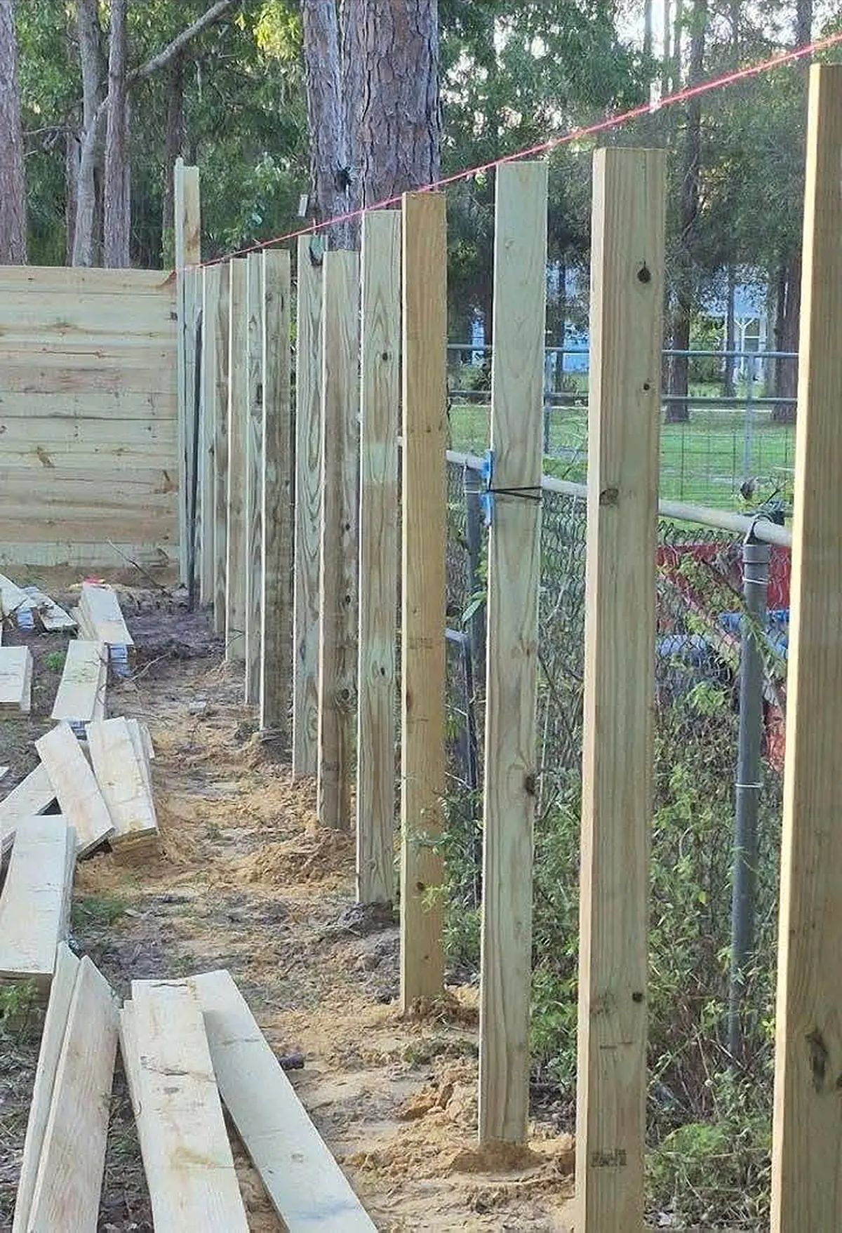 Fence posts set to a string line before the boards go on