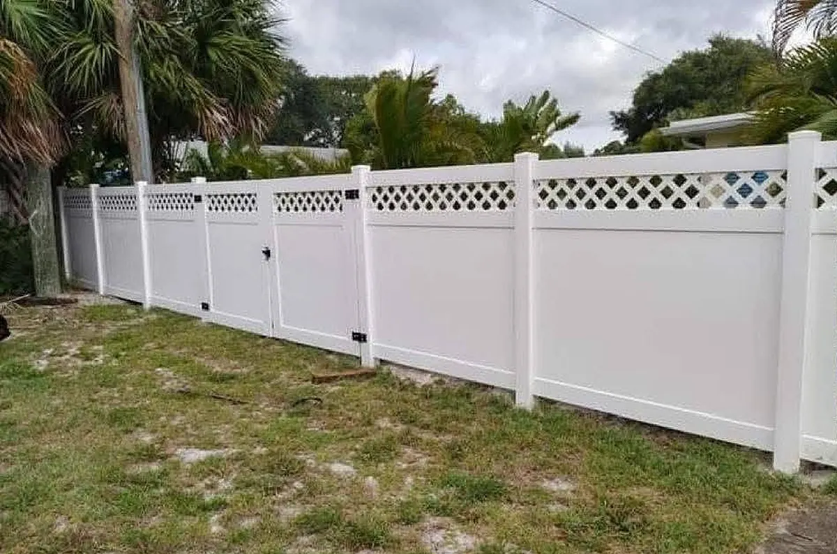 White PVC privacy fence with a lattice top