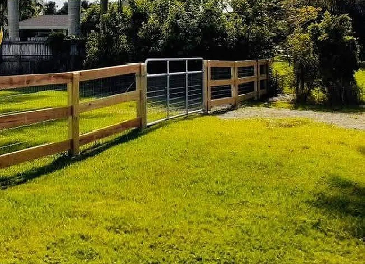 Three-rail ranch fence with wire mesh