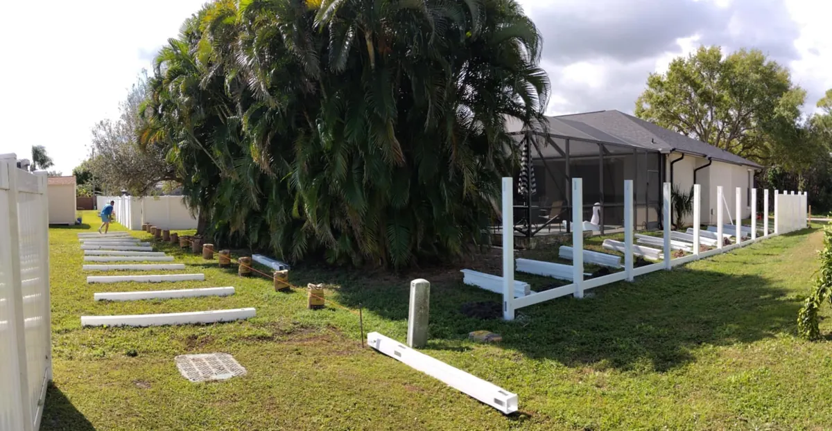 PVC fence posts and panels going in