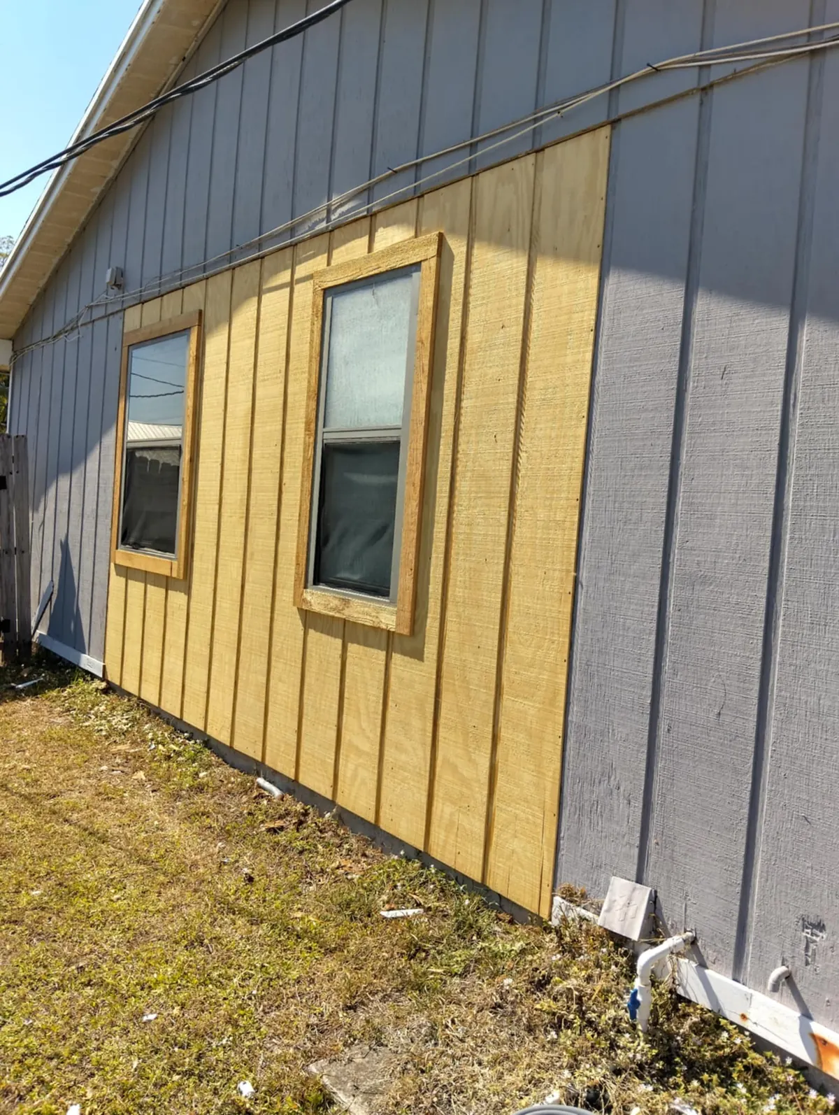New board and batten panels around the windows